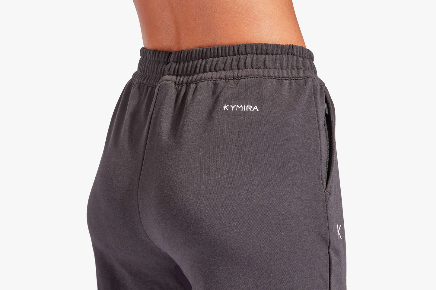 Luxury women's infrared recovery tracksuit bottoms by KYMIRA featuring a loose fit, elasticated waist, and cuffed ankles for ultimate comfort and relaxation.