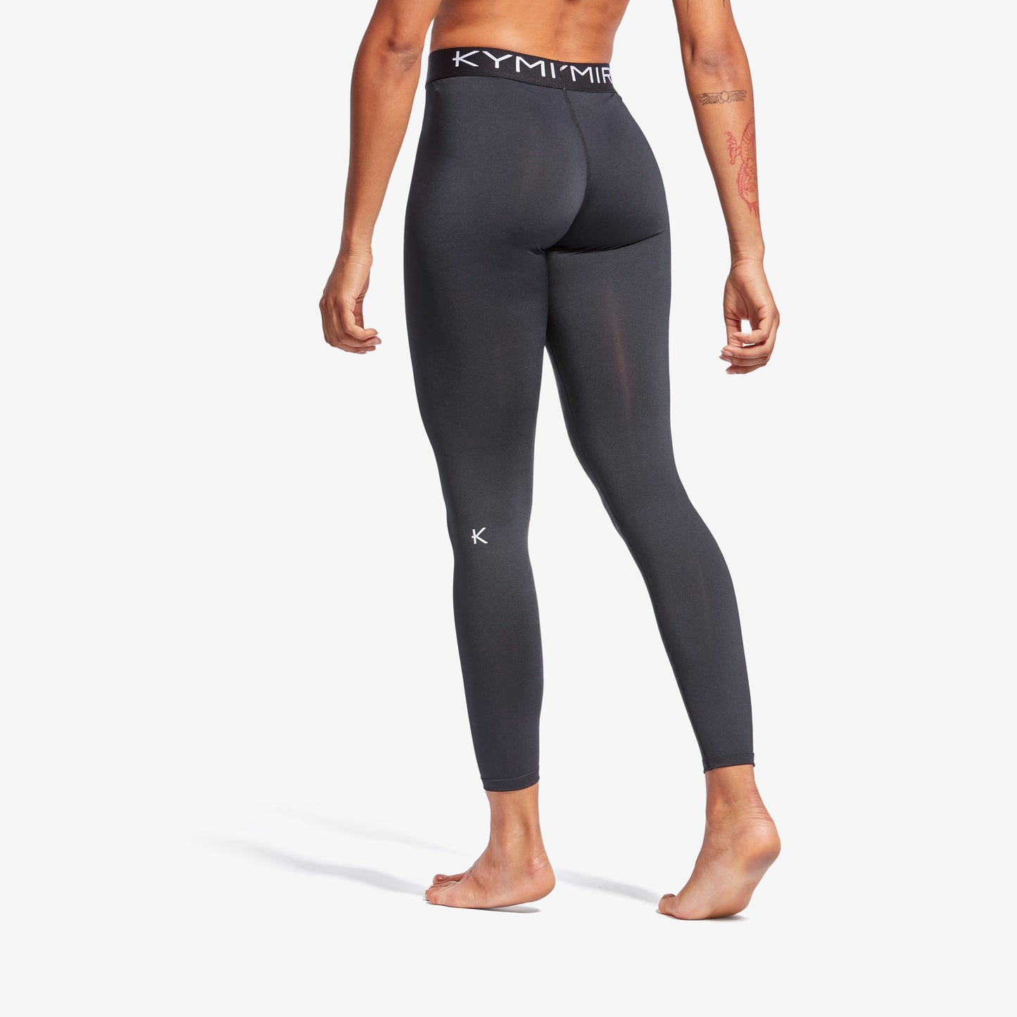 Women’s KYMIRA performance leggings styled for activewear fashion, emphasizing upscale materials and design suited for luxurious comfort.