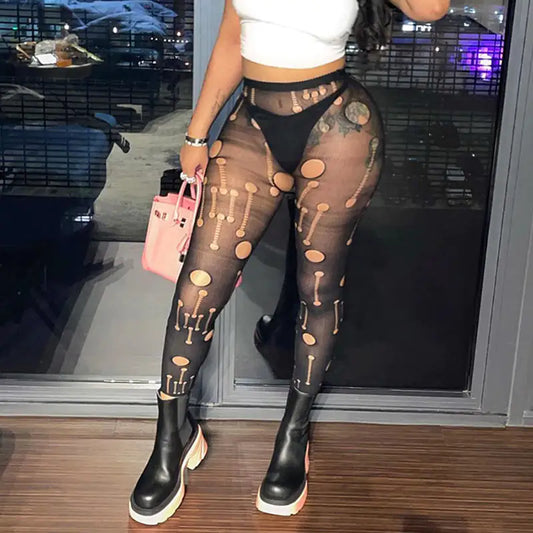 Stylish model wearing Women's Streetwear designer On My Blocked List Distressed Tights paired with a cropped top and chunky boots, showcasing a chic urban look.