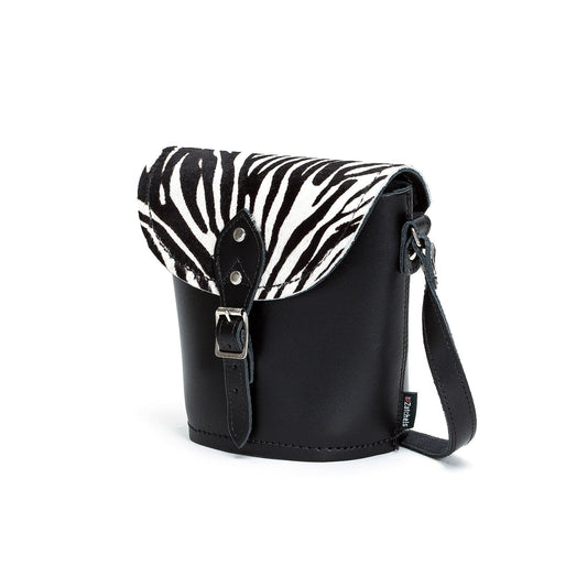 Chic zebra print barrel bag displayed with small size proportions, highlighting premium craftsmanship and elegant design.