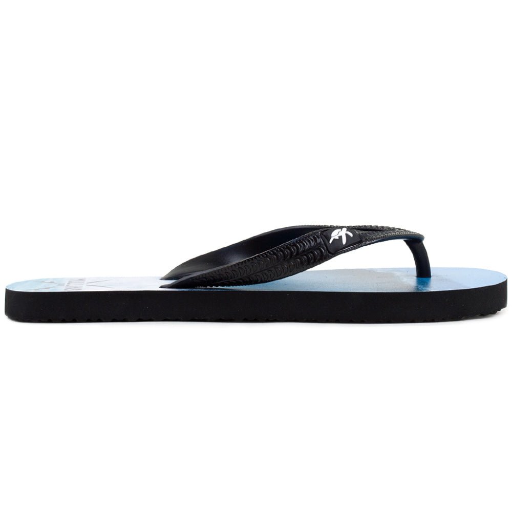 Elegant collection of Mullins Bay luxury black flip flops placed on a beach, perfect for summer fashion and leisure.