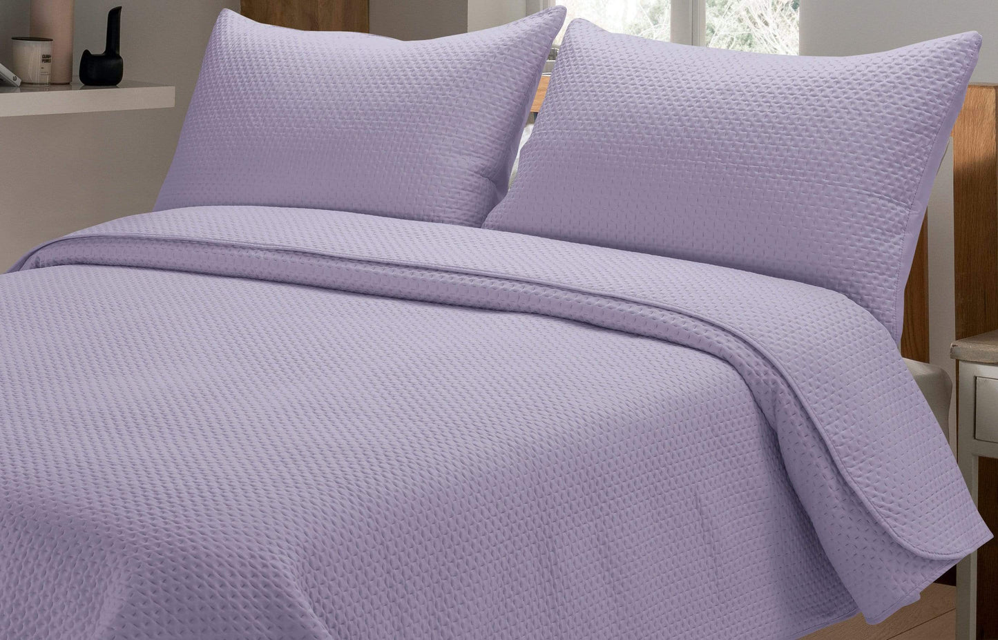 Close-up view of the luxurious embroidered pillow shams from the Capri Bedspread Set, adding a touch of opulence to any sleeping space.