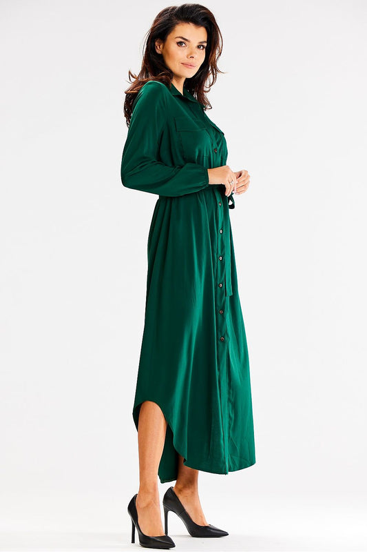 Stylish Awama maxi dress in a luxurious fabric, featuring long sleeves and a flattering waist tie for an exquisite look.