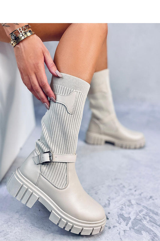 Elegant Inello women's officer boots featuring a thick sole and stylish buckle straps, designed in a minimalist sock style for effortless wear.