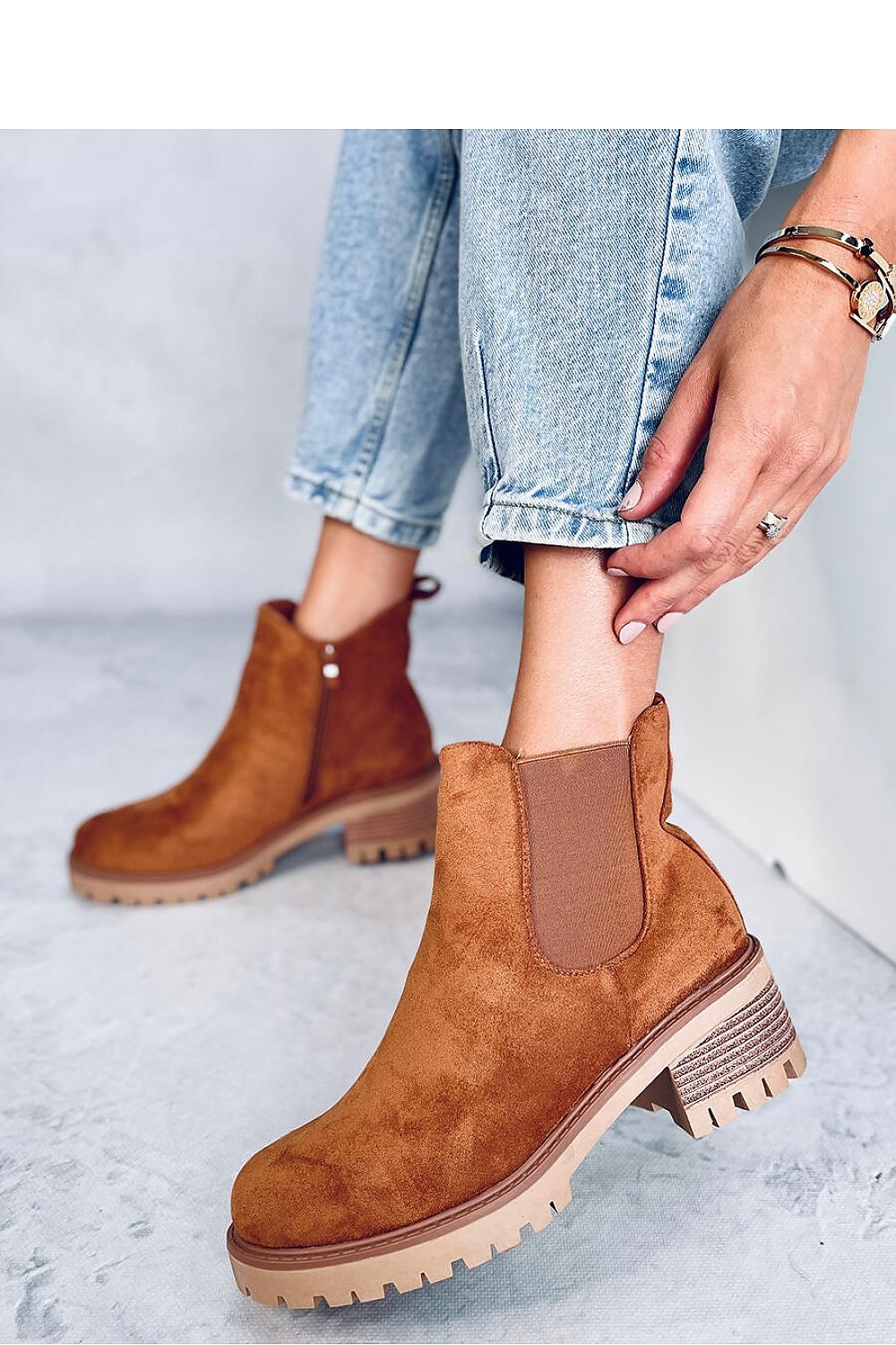 Elegant women's jodhpur booties featuring a 5.5 cm heel, crafted from eco-suede with soft fur lining, designed by Inello for a luxurious and comfortable fit.