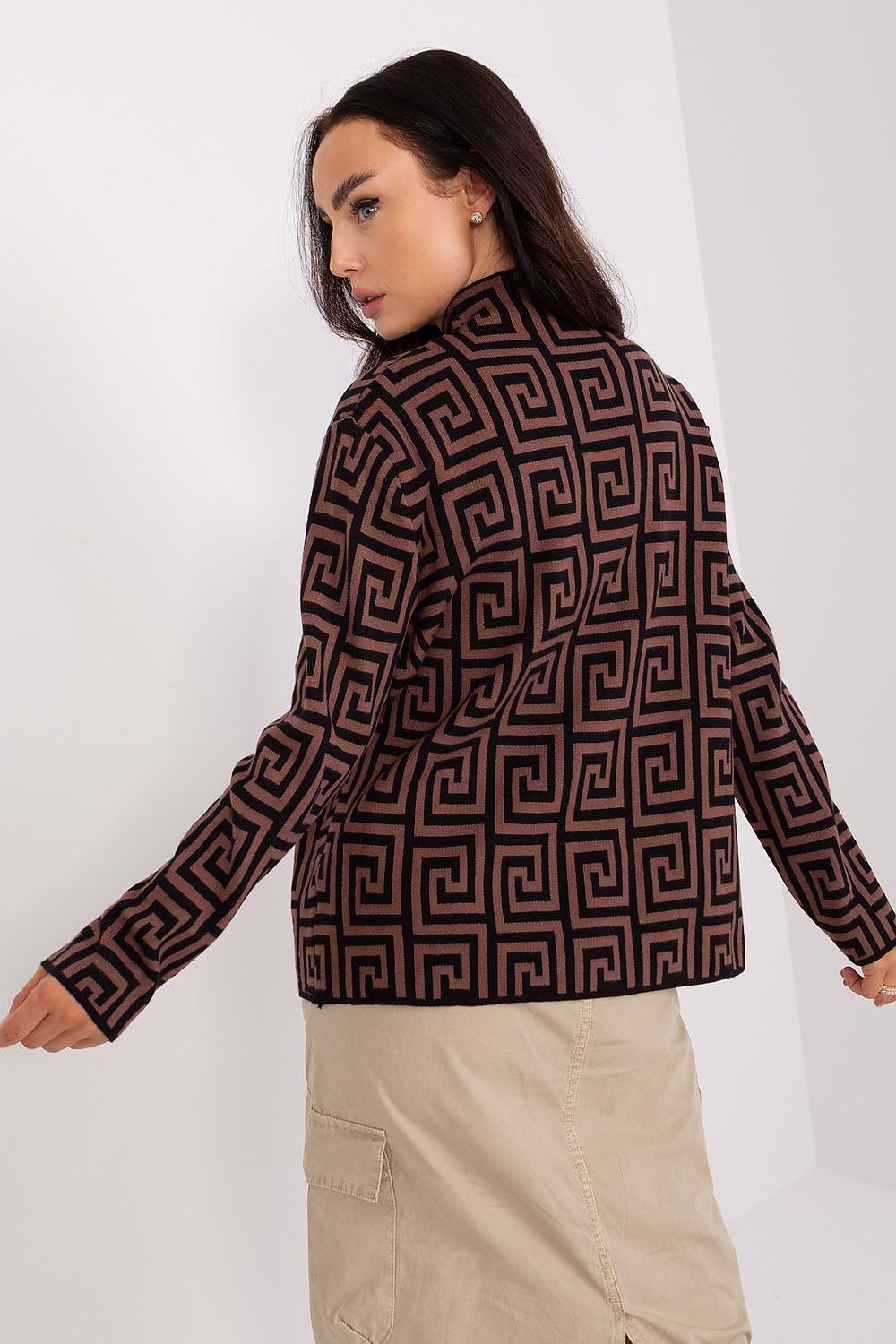 Versatile women's sweater by AT with a contemporary geometric pattern and zippered pockets, combining style with practicality for modern lifestyles.