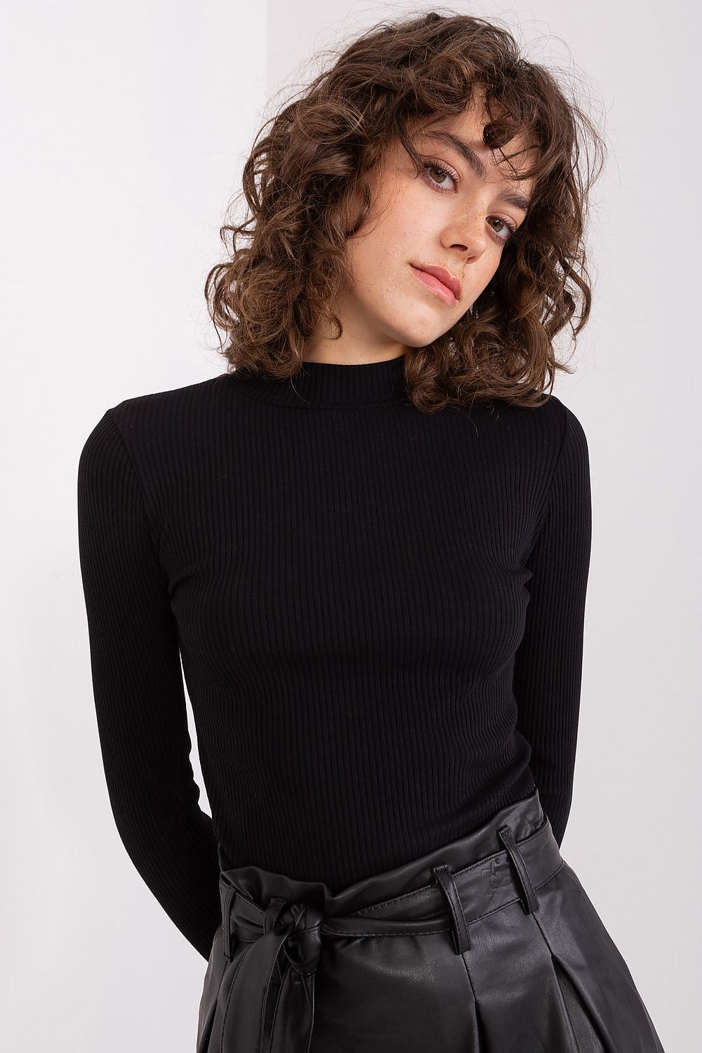 Elegant ribbed cotton blouse with half turtleneck by BFG, showcasing a fitted silhouette and long sleeves, ideal for stylish comfort on colder days.