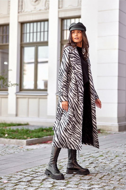 Stylish long coat for women by Roco Fashion, showcasing a sophisticated silhouette with a waist tie and side pockets.