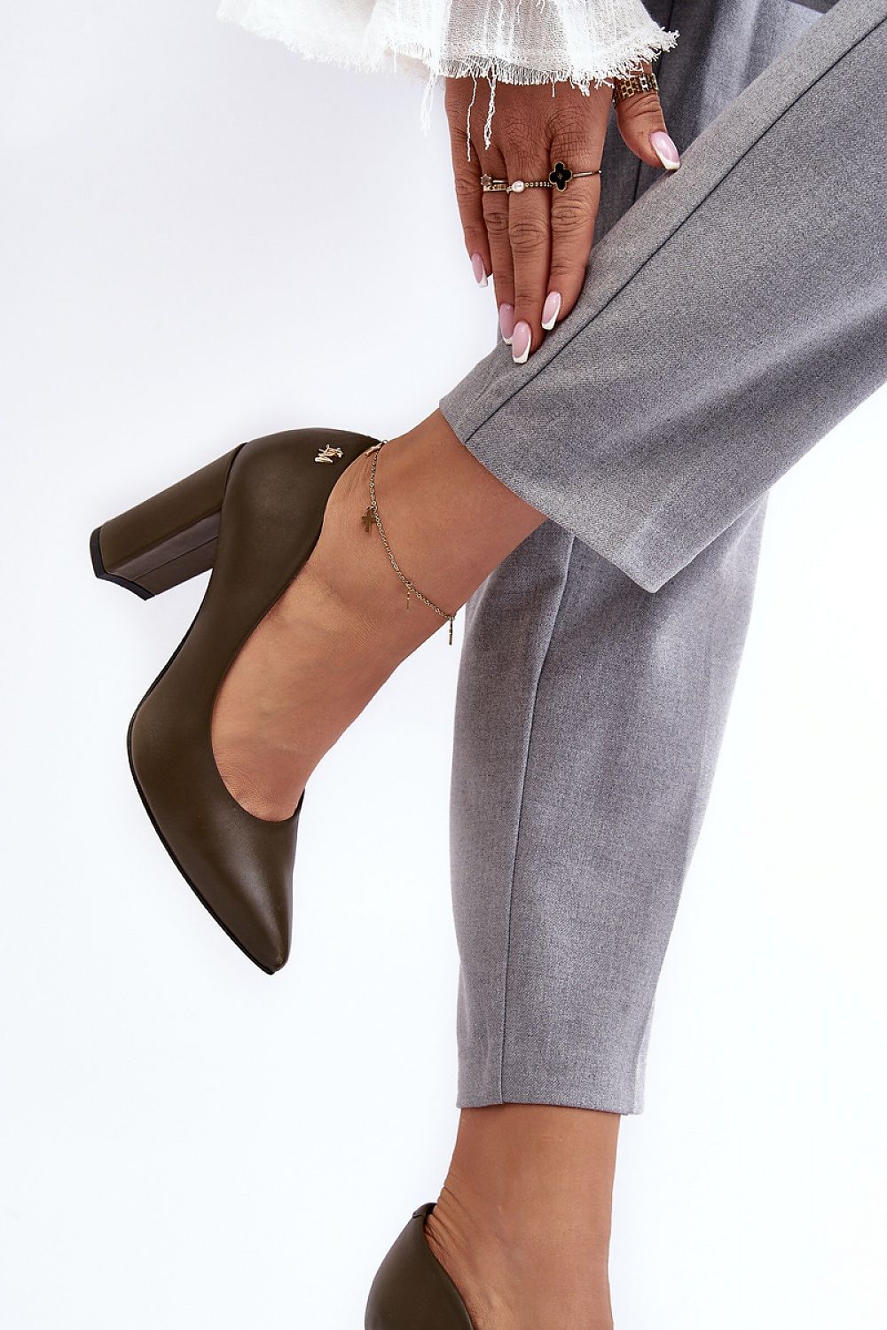 Stylish women's block heel pumps by Step in Style, highlighted with a pointed toe design, perfect for elevating any upscale outfit.
