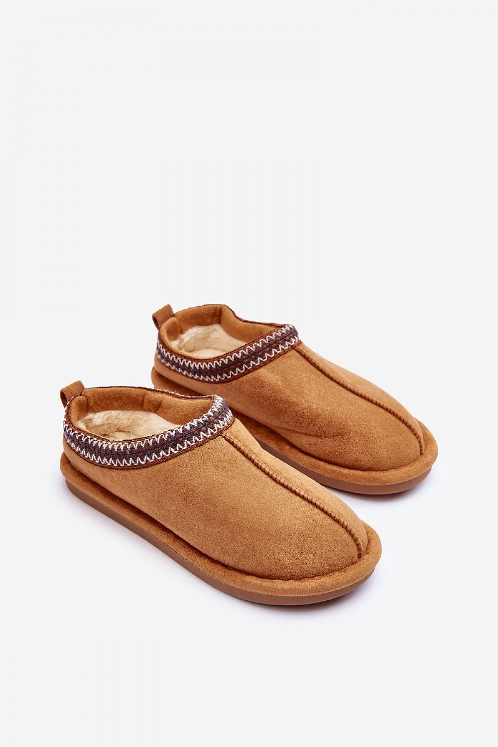 Step in style eco-suede slip-on slippers featuring thick fur lining and a non-slip sole, designed for luxurious winter comfort.
