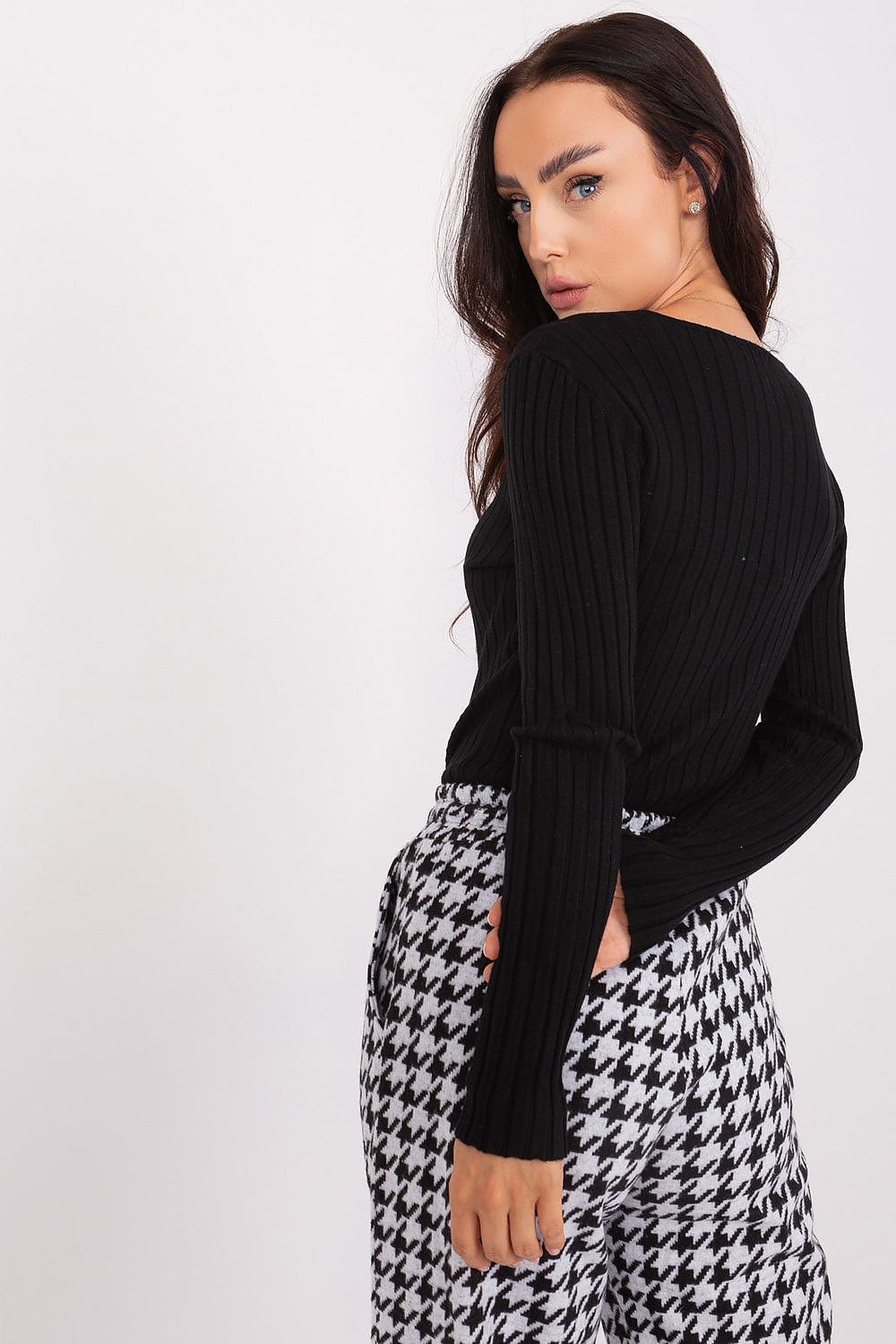 Elegant V neckline detail on a stylish ribbed women's sweater from Factory Price, crafted for comfort and grace in everyday fashion.