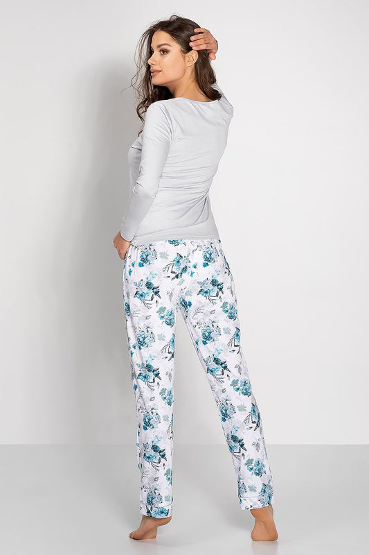 Stylish elegance of Momenti Per Me's women's pajama set showcasing delicate trims and natural materials, perfect for a lavish night in.