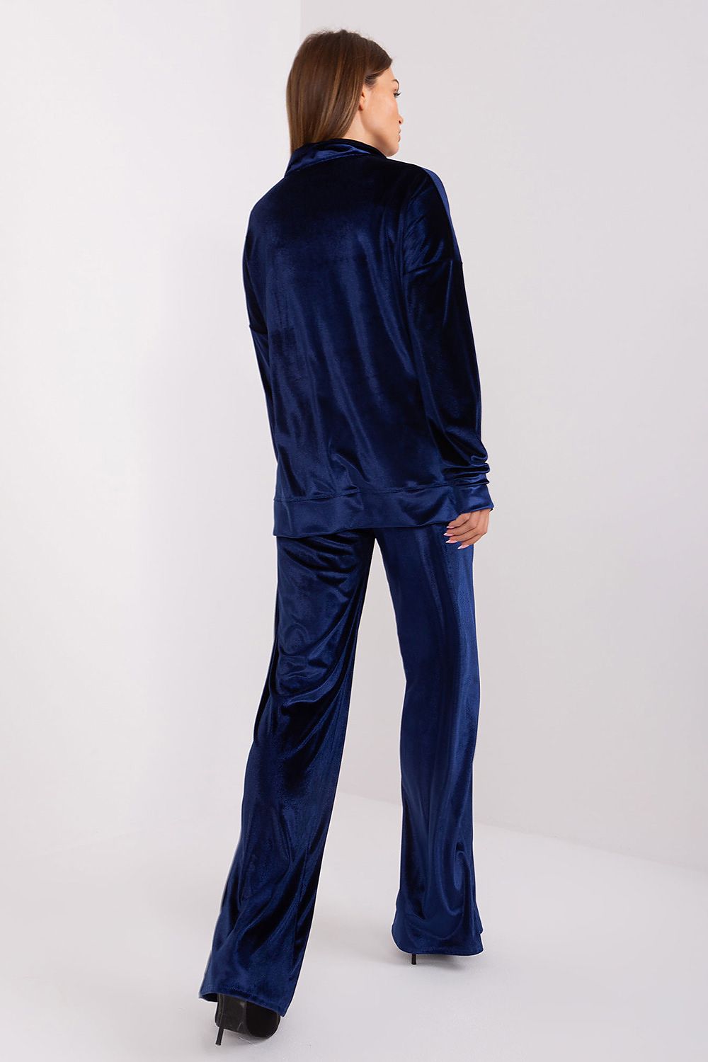 Model wearing Lakerta Women's Velour Comfort Set, highlighting the chic design of the high waist wide leg pants and the flattering fit of the long sleeve blouse.