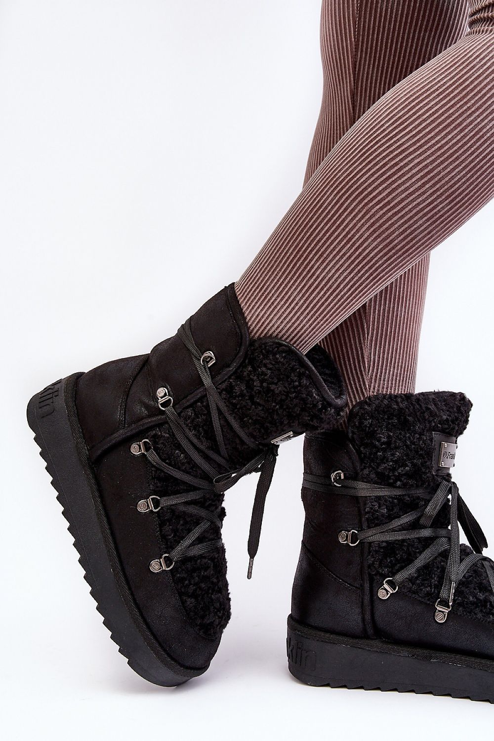 Chic slip-on design of women's insulated snow boots from Step In Style, combining luxury vegan materials with practicality for winter adventures.