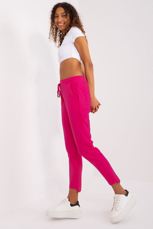 Side view of women's luxury sweatpants by Relevance, showcasing practical pockets and sporty silhouette.
