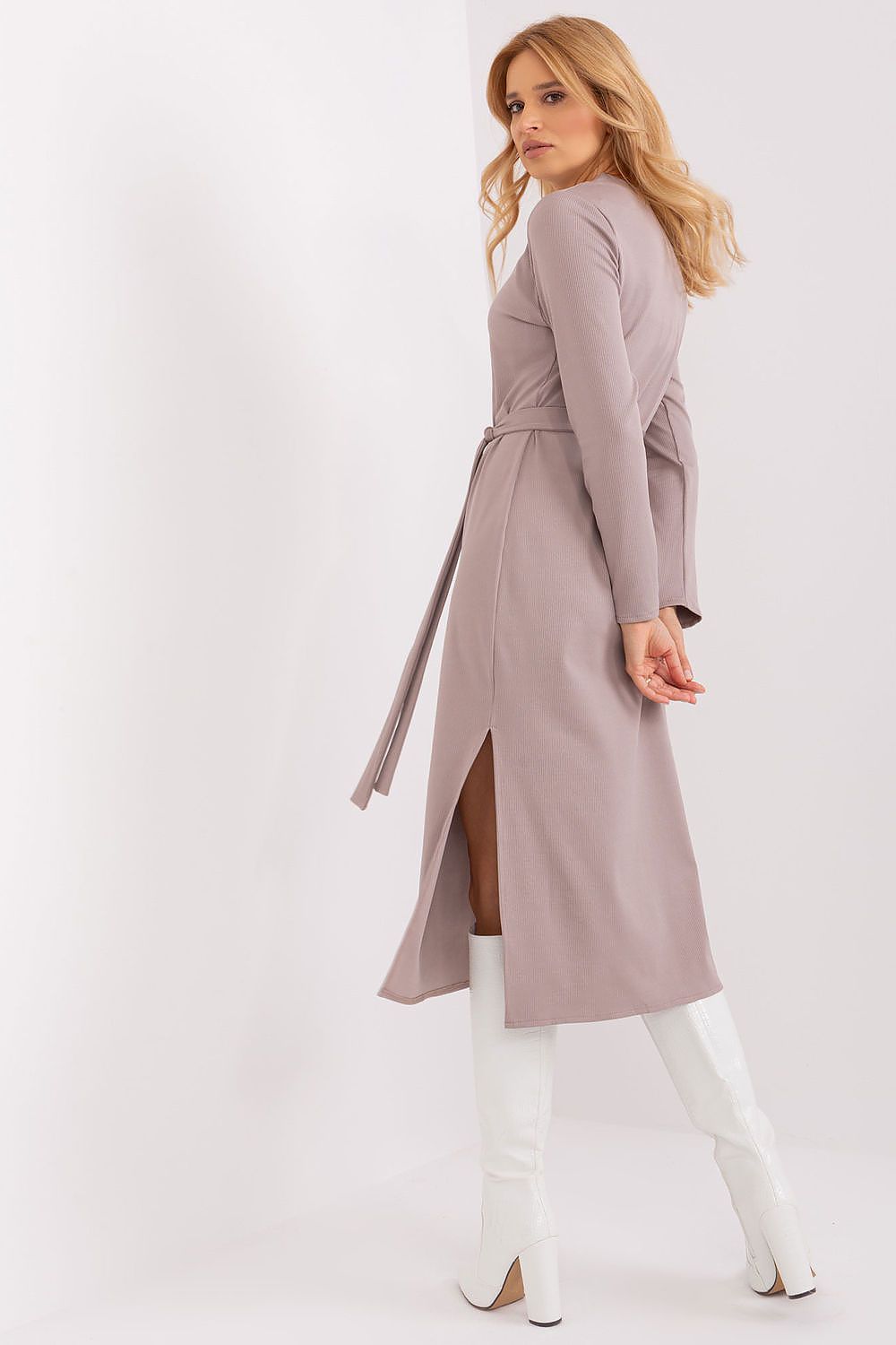 Stylish Lakerta dress displayed on a mannequin, highlighting its long sleeves and flowing silhouette ideal for sophisticated events.