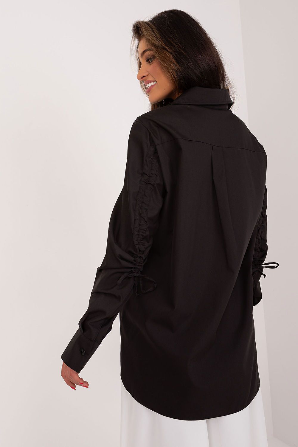 Luxurious Lakerta Women's Casual Shirt in breathable fabric with modern design and unique ribbing elements.