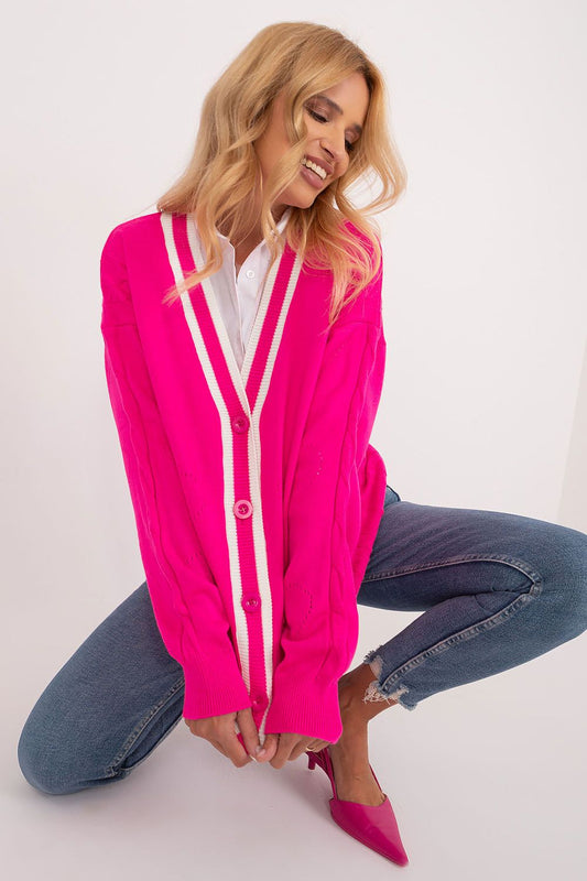 Graceful pose of a woman in a trendy Badu long sleeve cardigan in eye-catching pink, demonstrating its chic style and versatility for various occasions.
