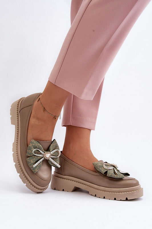 Chic luxury women's natural leather moccasins adorned with a designer bow, perfect for a fashionable spring look by Step in Style.