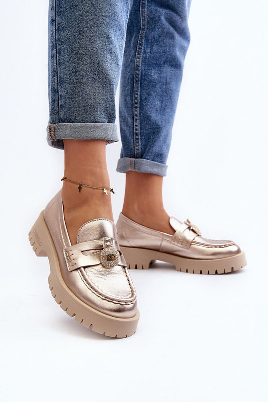 Chic luxury moccasins by Step in style, spotlighting decorative accents and a modern design, elegantly paired with casual denim.