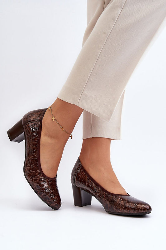 Chic brown block heel pumps with almond toe, styled elegantly with beige trousers, from the vendor Step in Style.