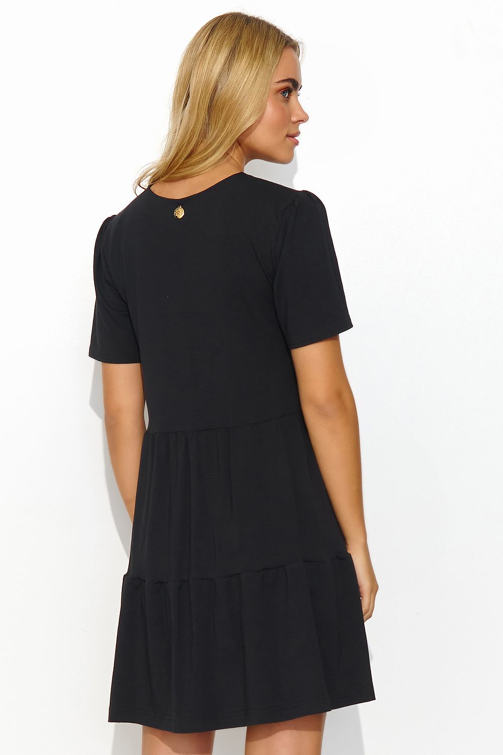Stylish black summer daydress by Makadamia, showcasing a graceful v-neck and short sleeves, with a tiered skirt and a distinctive gold detail at the back for elegant flair.