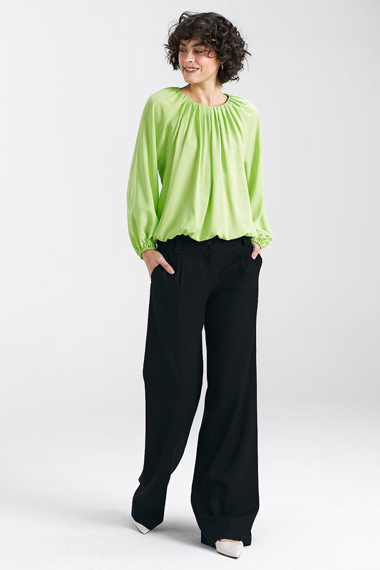 Nife lime viscose summer blouse showcased with black trousers, highlighting its loose fit and stylish design, perfect for casual outings.