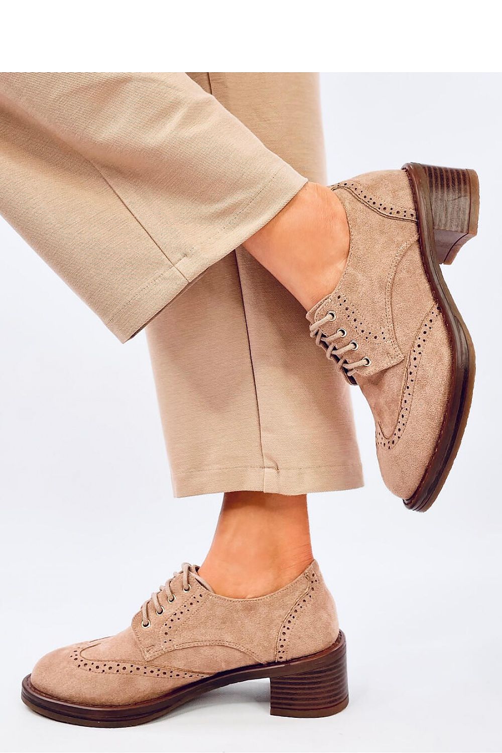 Sophisticated lace-up moccasins for women by Inello, designed with a luxurious eco-friendly suede and a comfortable heel for elegant wear.