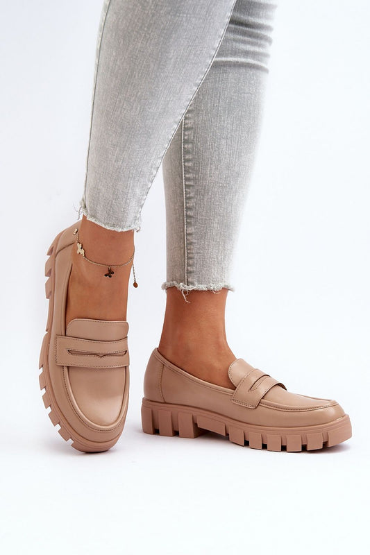 Luxury women's moccasins by Step in Style, featuring eco leather, a natural leather insole, and a stylish strap, showcased in a casual outfit.