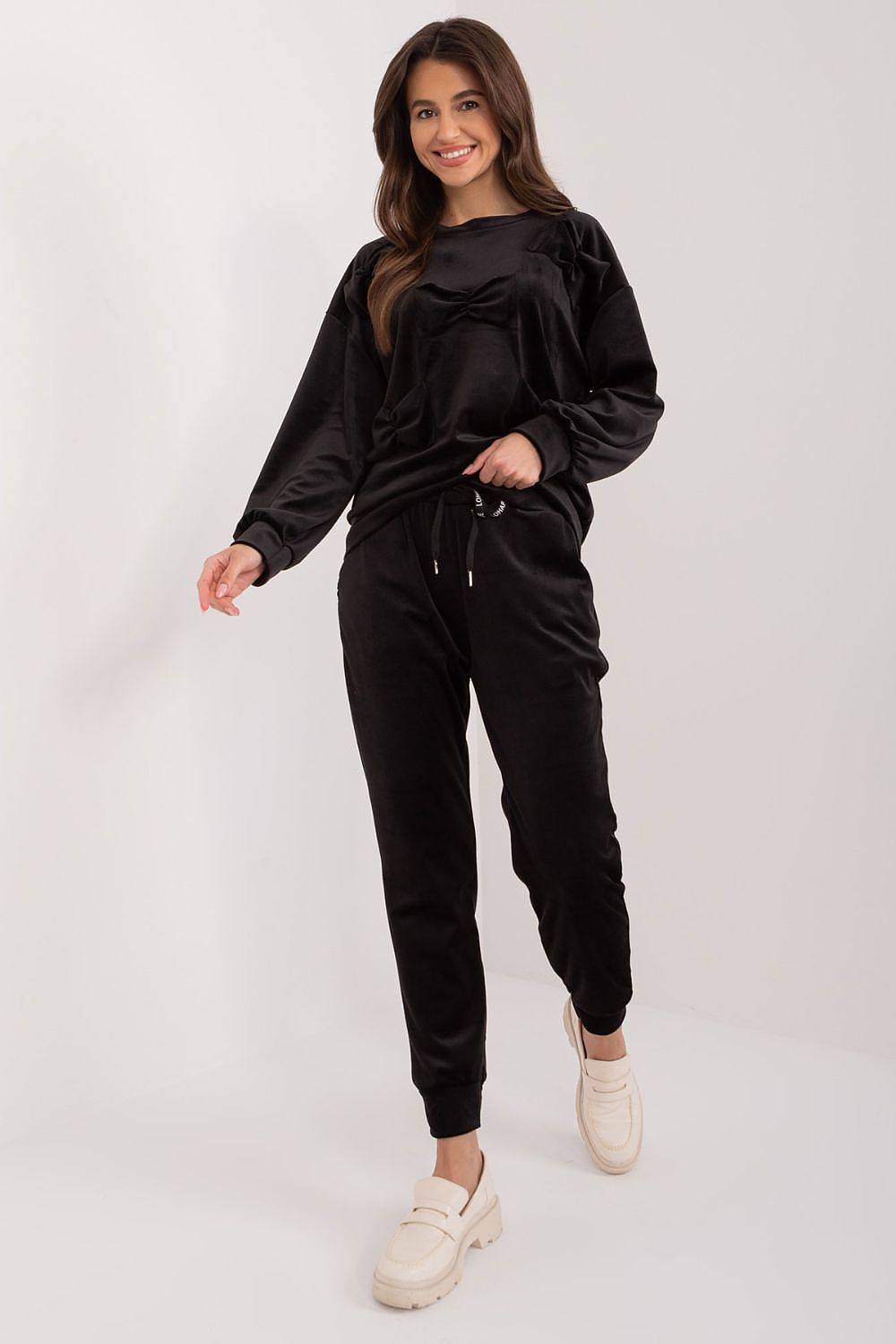 Detailed view of the Italy Moda velour set's side slip pockets and drawstring pants, combining practicality with luxury.