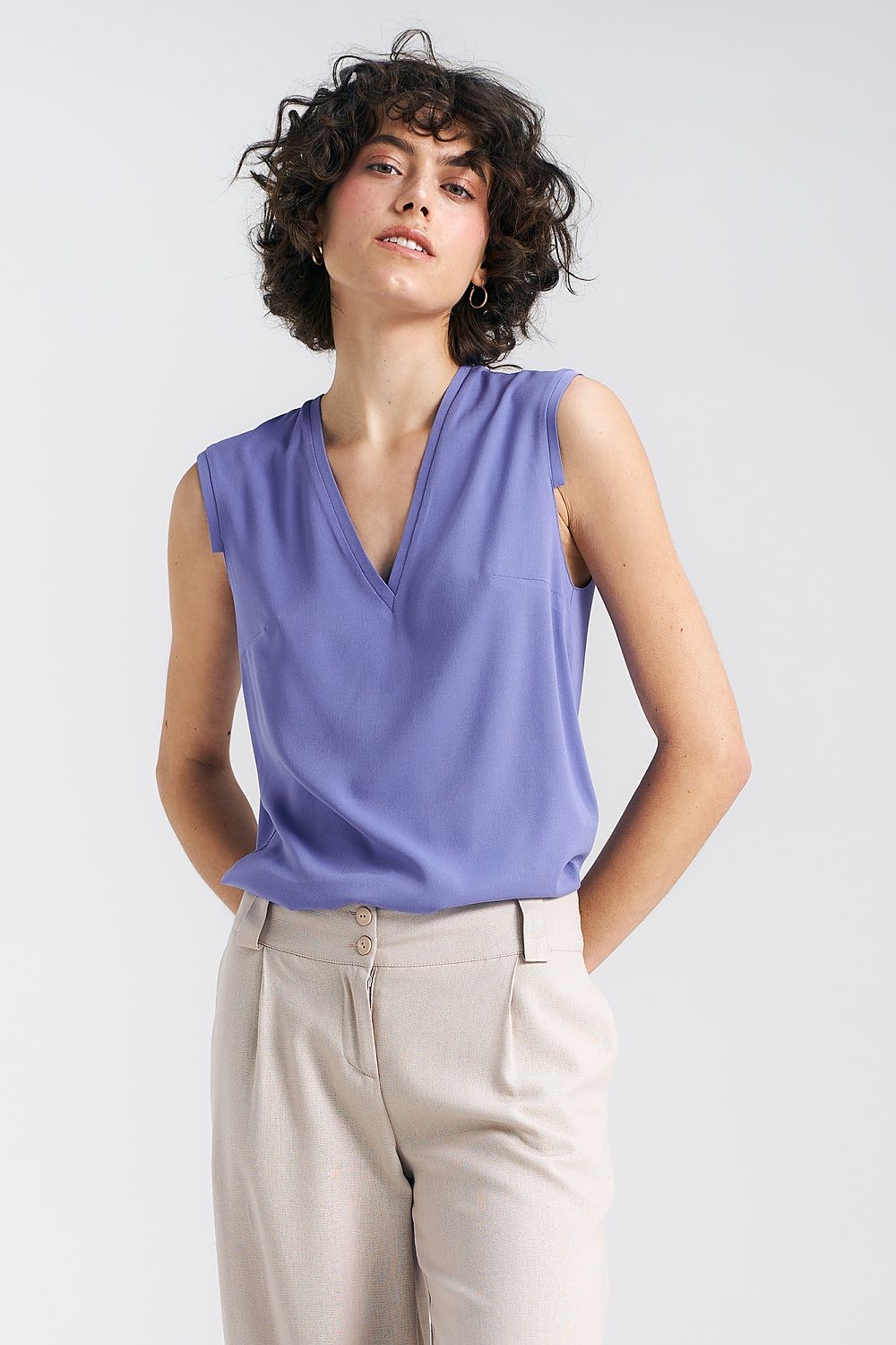 Elegant Plum Viscose Blouse by Nife with V-neckline and delicate pleat detail, showcasing luxurious fabric and sophisticated design perfect for feminine summer styles.
