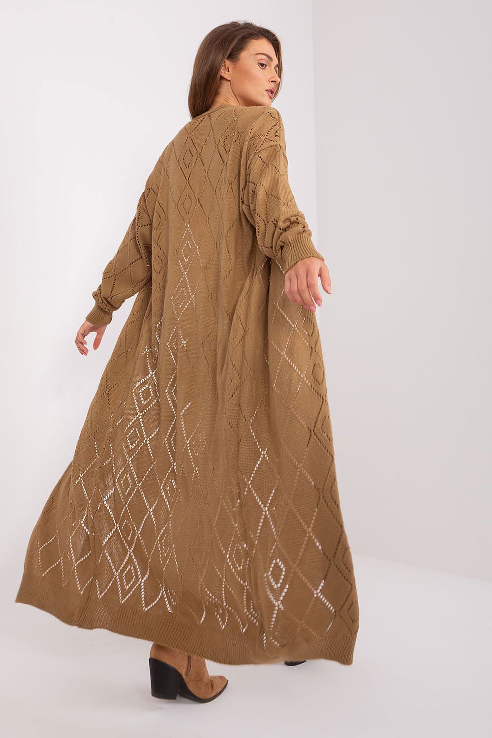 Sophisticated long sleeve cardigan by Badu, showcasing intricate openwork design ideal for elegant dressing.