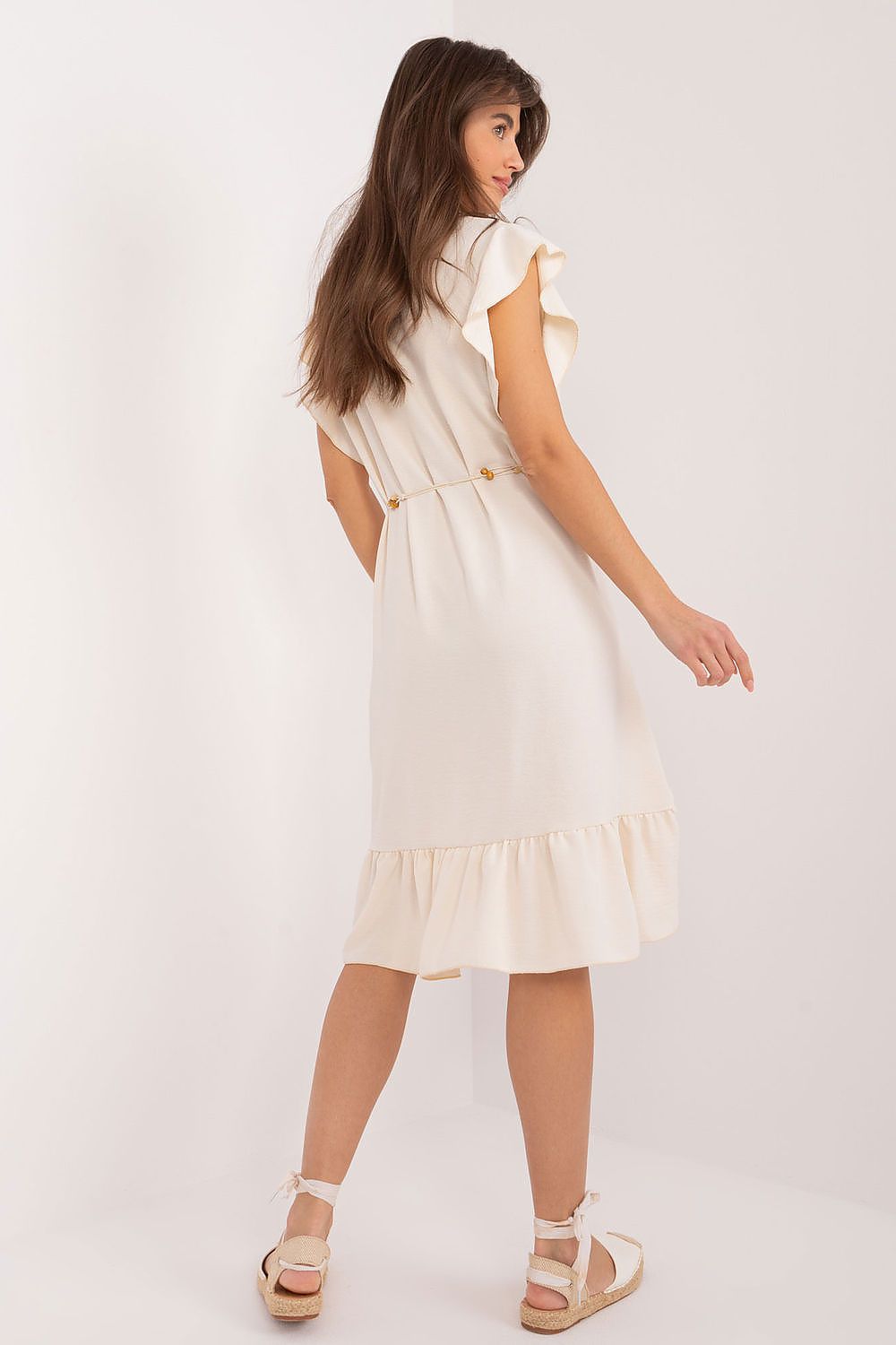 Italy Moda's flared daydress in smooth polyester, highlighting a unique asymmetrical style and delicate ruffle sleeves perfect for warm summer occasions.
