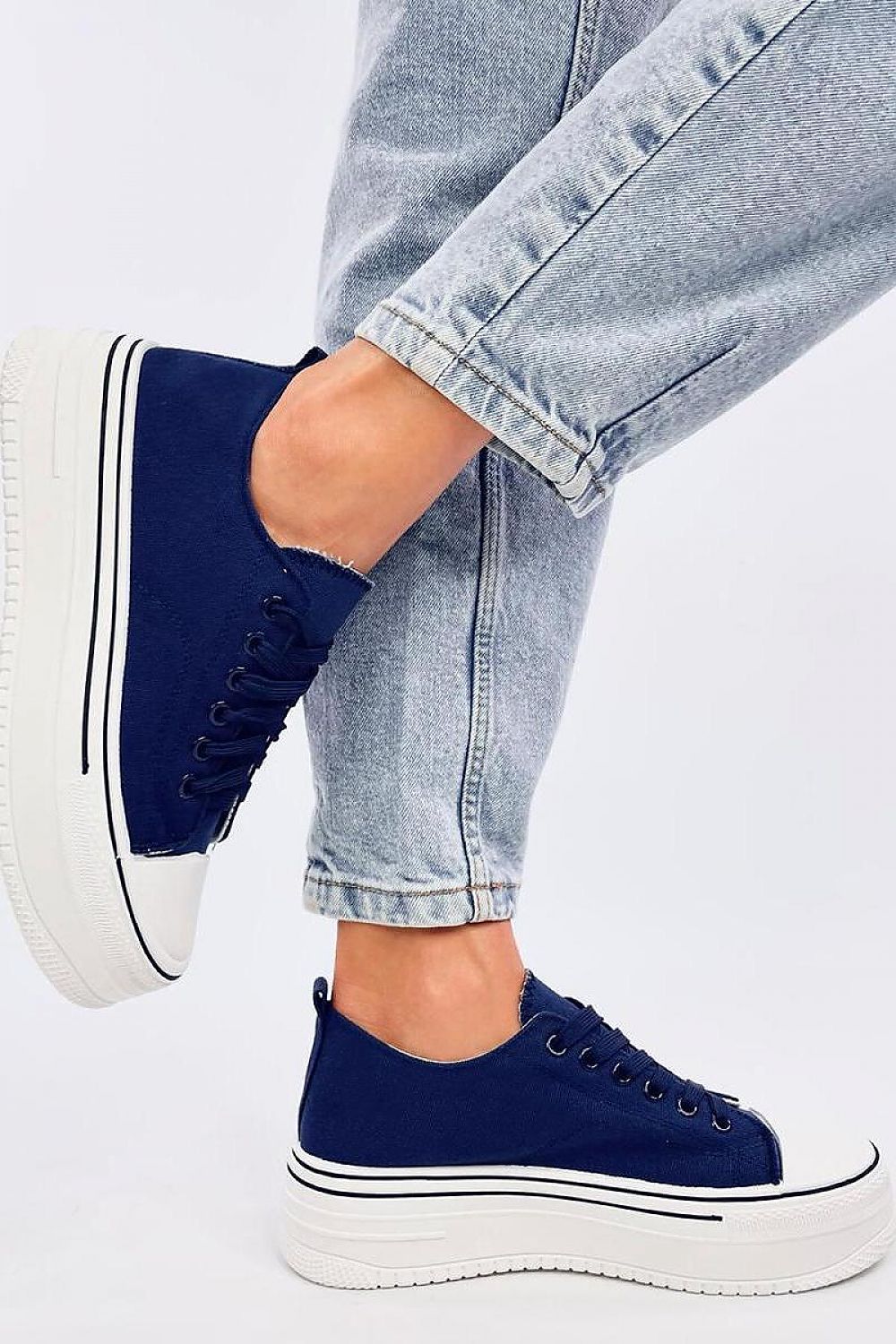 Chic women's platform sneakers from Inello, showcasing a modern navy fabric exterior and a distinctive high sole, designed for both comfort and fashion-forward looks.