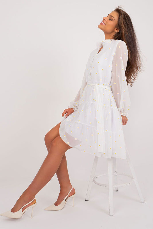 Chic white cocktail dress by Lakerta, adorned with delicate floral embroidery, showcasing a relaxed fit and ruffled sleeves, perfect for any elegant occasion.