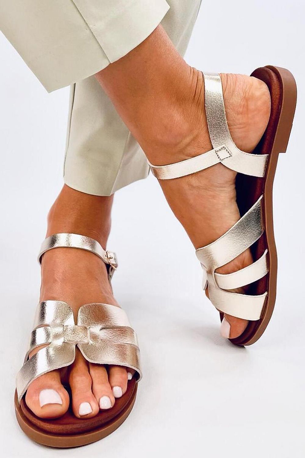 Inello Women's Elegant Flat Sandals in eco-friendly leather, featuring adjustable ankle straps for a luxurious and comfortable fit, perfect for summer styling.