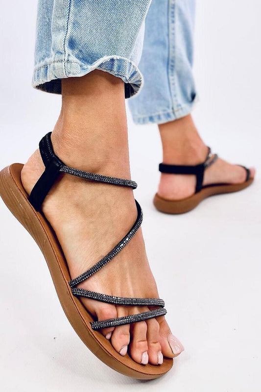 Chic and comfortable women's flat sandals from Inello, designed with exquisite cubic zirconia detailing on synthetic leather straps, perfect for elevating your summer outfits.