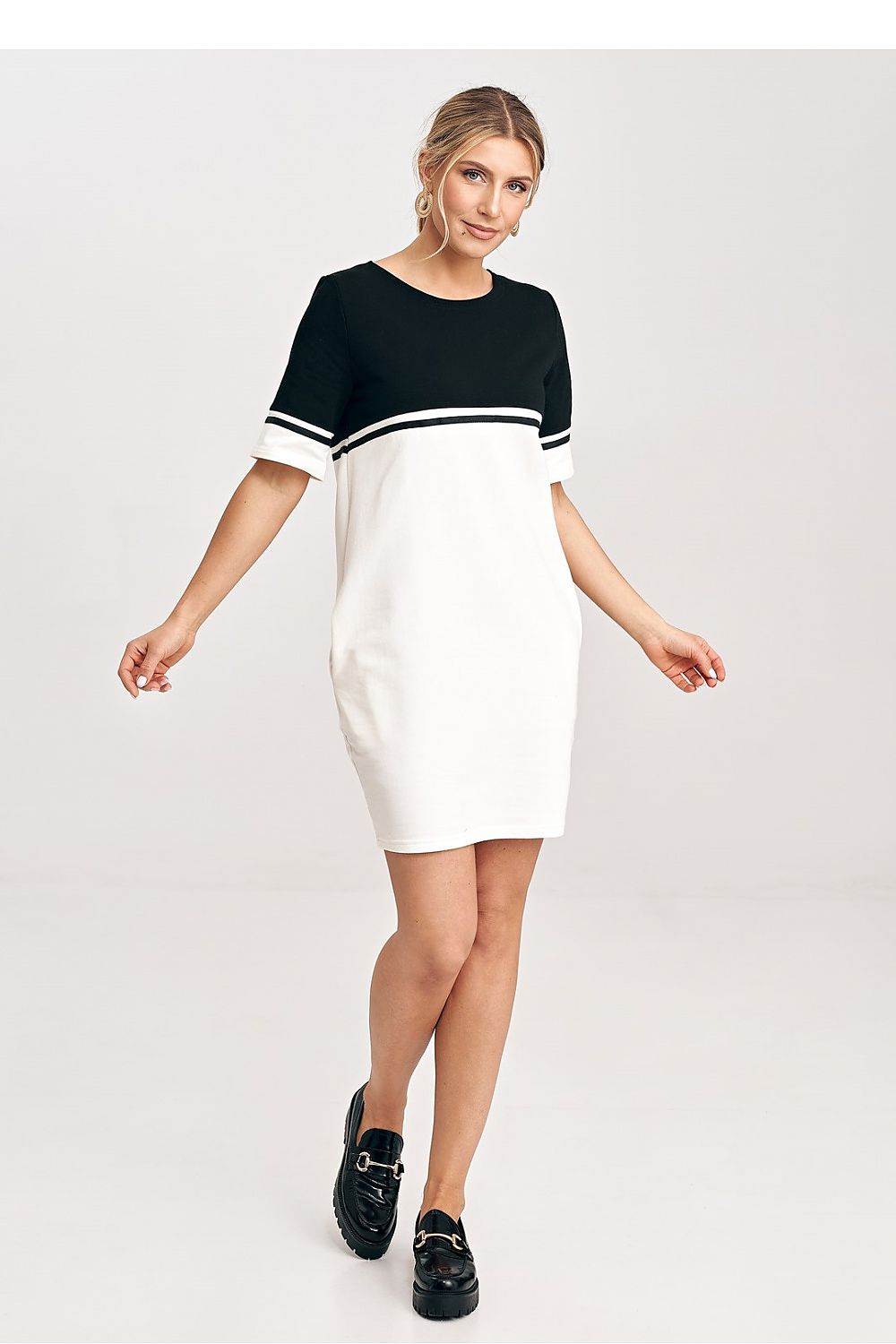 Model wearing the elegant two-tone cotton mini dress by Figl, highlighting its flattering fit and chic everyday versatility.