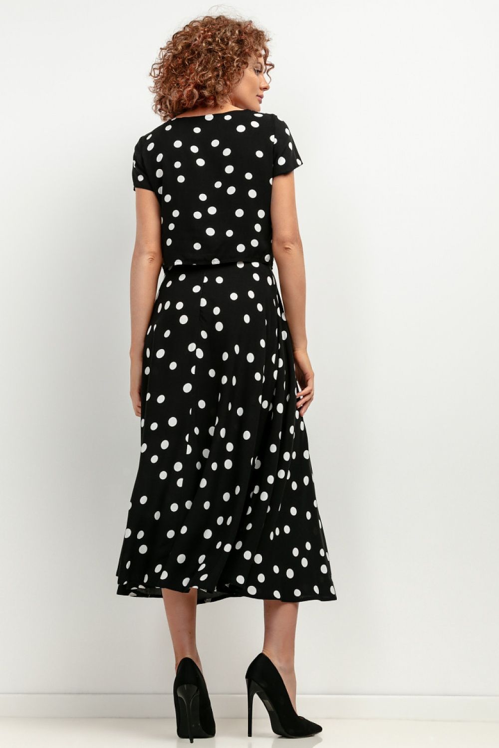 Detail view of Tessita's patterned viscose skirt, emphasising its original design and luxurious quality.