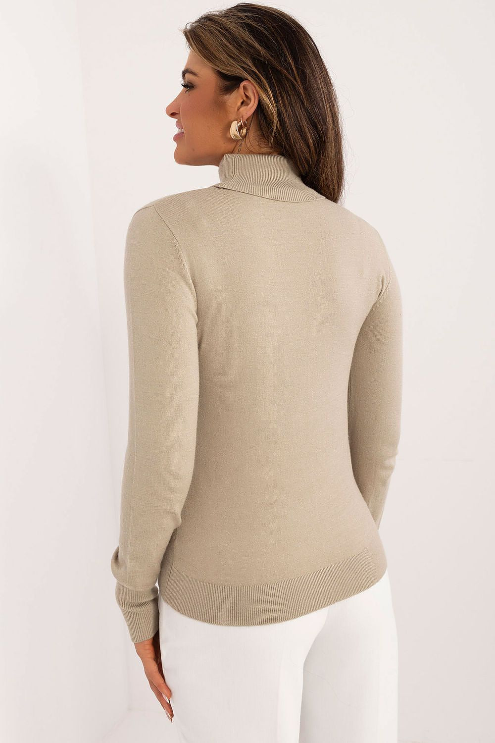 Model wearing Sublevel's elegant women's turtleneck sweater, demonstrating its versatile styling options for a chic, comfortable look.