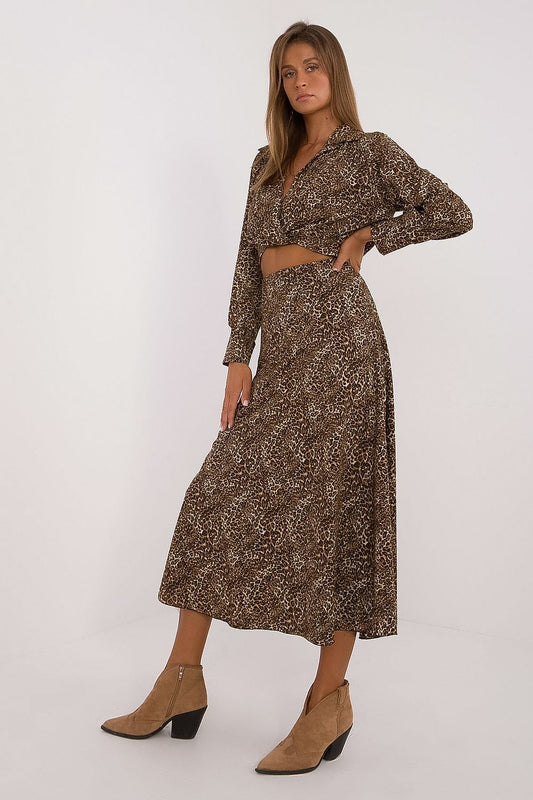 Elegant women's animal motif set by Italy Moda featuring a luxurious long-sleeve blouse with a wrap neckline and a coordinating skirt, perfect for stylish everyday wear.