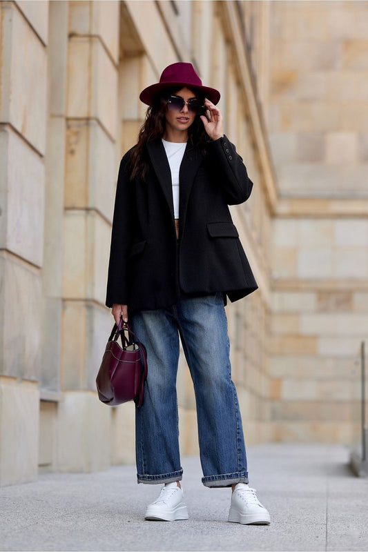 Stylish long-sleeved blazer by Roco Fashion, featuring a modern relaxed fit and ornate cuff buttons, ideal for versatile dressing.