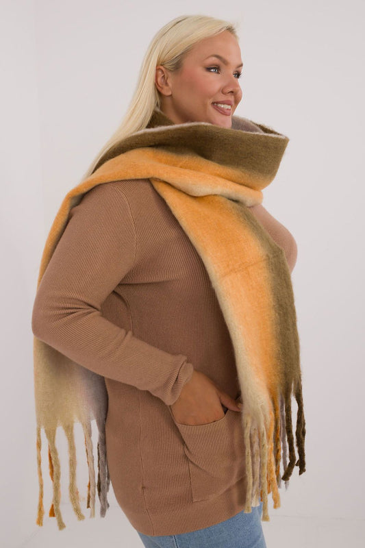 High-quality polyester scarf from AT, elegantly designed with decorative tassels, ideal for stylish autumn-winter layering.