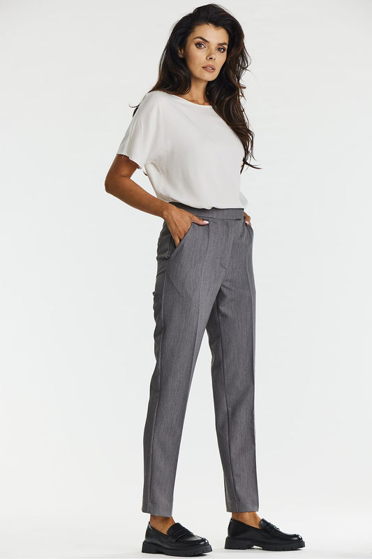 Stylish close-up of the fabric texture of women's gray cigarette trousers by Awama, highlighting the smooth and comfortable blend of viscose, polyester, and spandex.