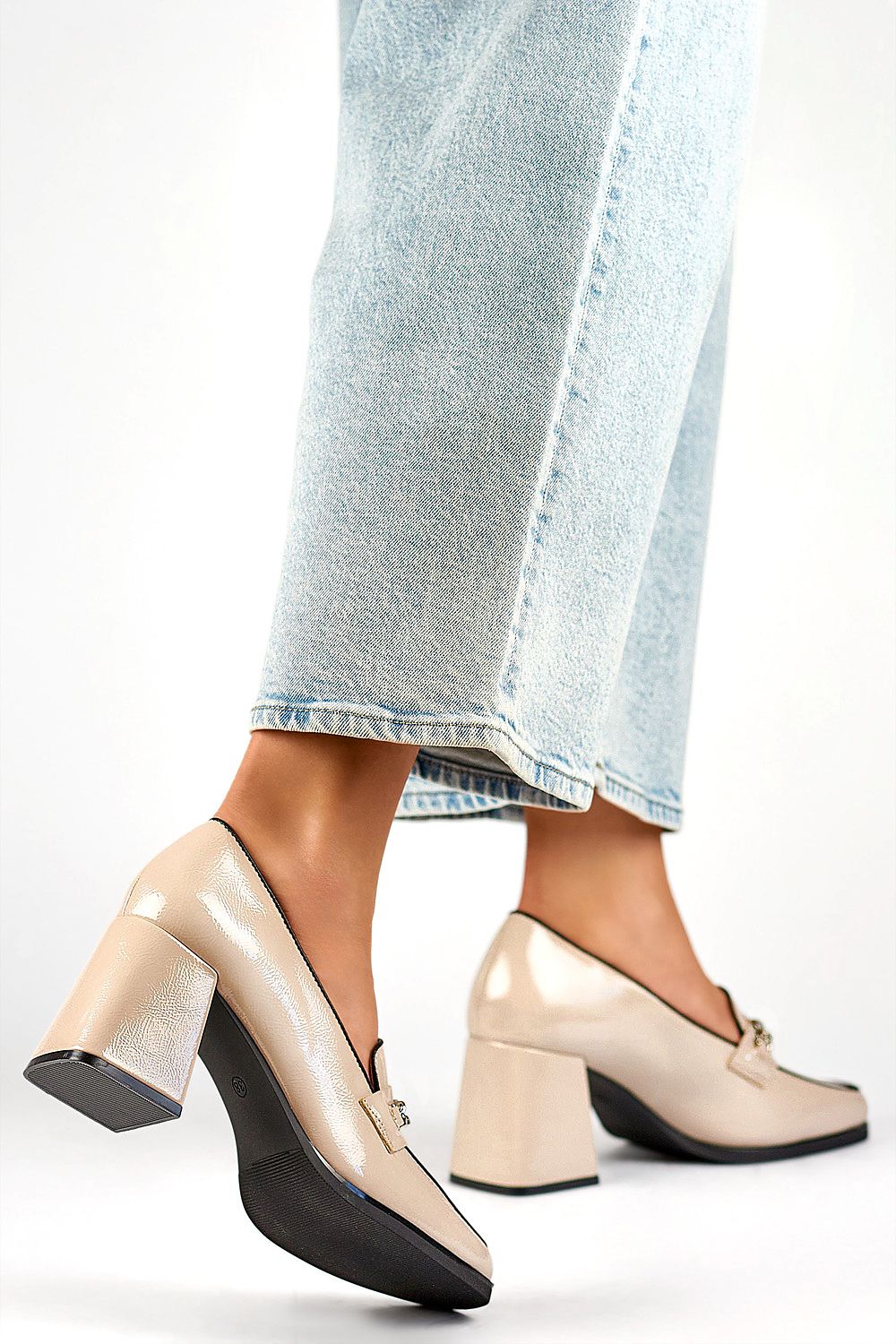 Elegant beige patent leather block heel pumps by PRIMO, showcasing a luxurious 7.5 cm stiletto heel and a classic comfort design, perfect for any occasion.