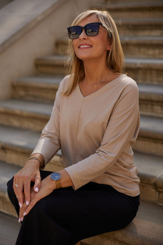 Detailed view of La Aurora blouse showcasing the luxurious metallic gold thread stitching at the neckline and sleeves, designed for sophisticated mature women.