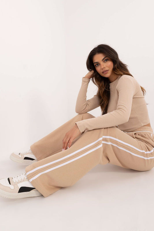 Elegant women's casual sporty set by Factory Price featuring a long sleeve blouse and high-waisted trousers, designed for comfort and style.