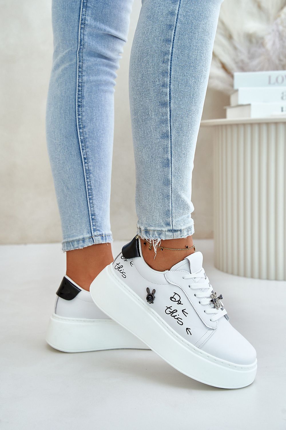 Step in style luxury women's sneakers in natural leather, designed with a decorative pin and crafted for comfort, suitable for EU sizes 36-40.