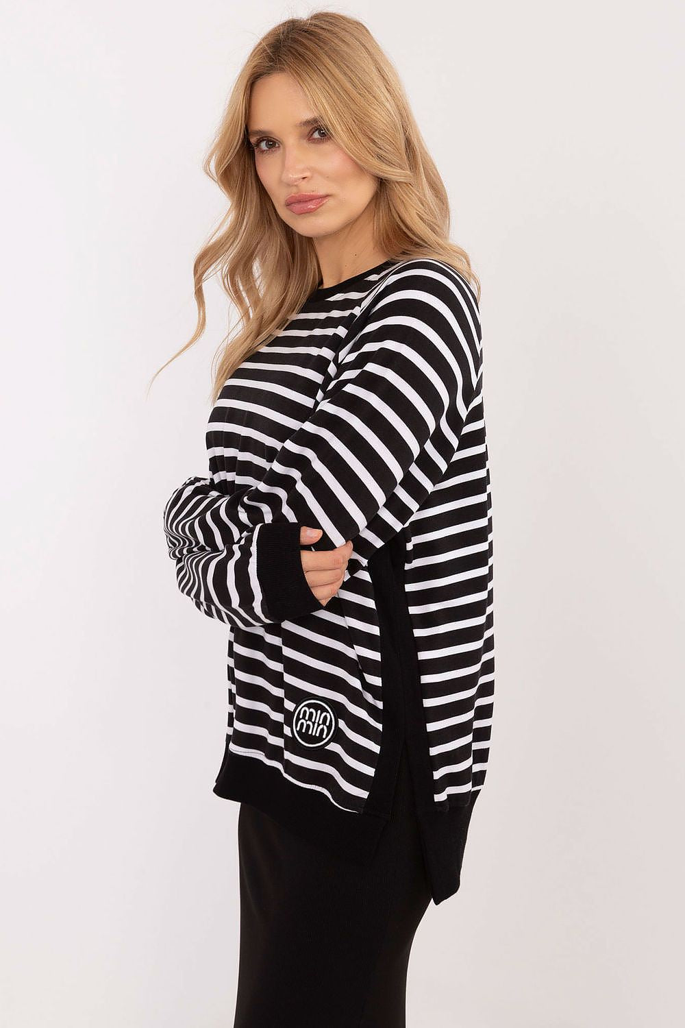 Versatile yet chic Relevance elegant striped blouse, highlighting its classic round neckline and sophisticated long sleeves, suitable for both work and leisure.