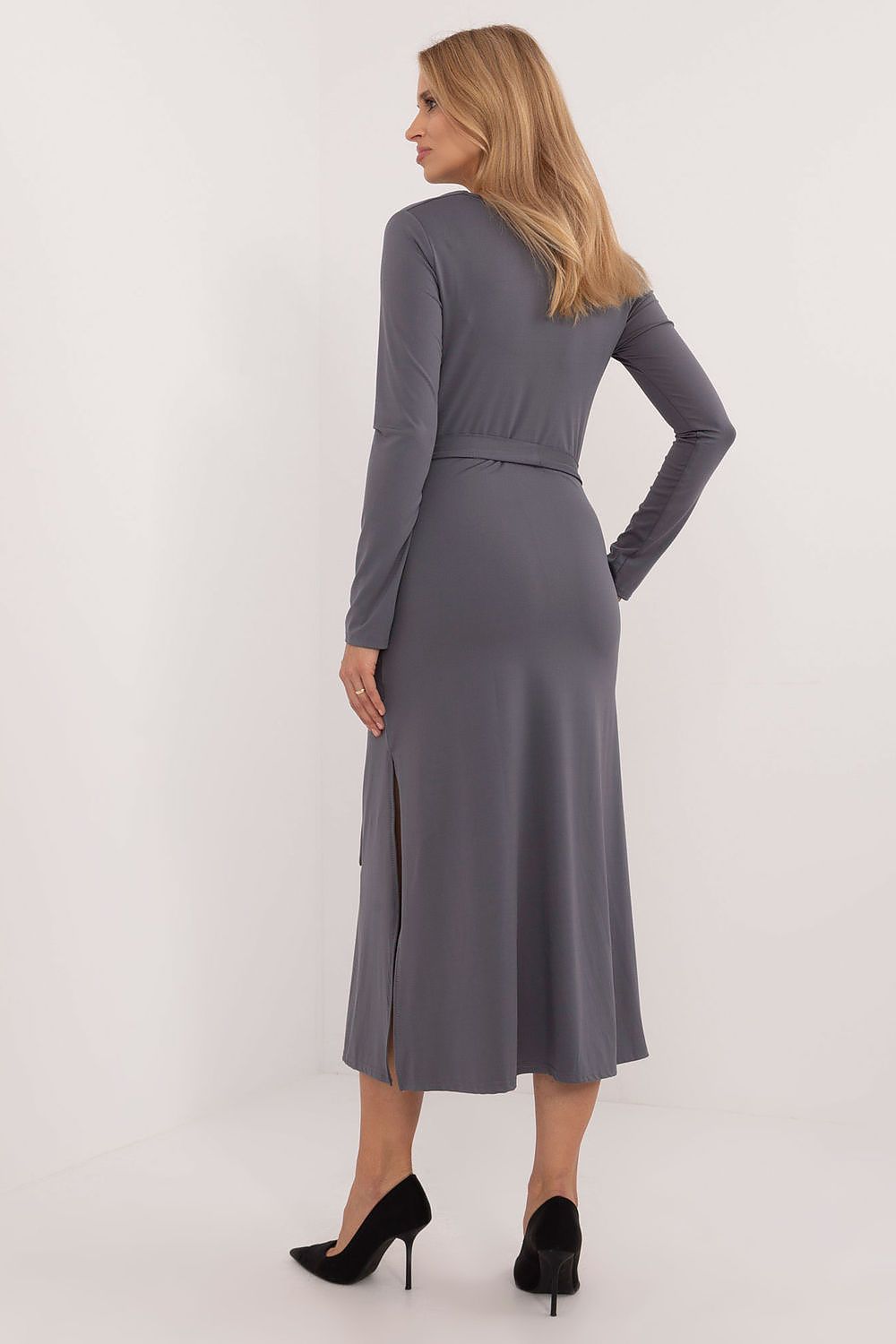 Full-length image of the Lakerta Midi Dress styled elegantly, demonstrating its sophisticated silhouette and flowing neckline.